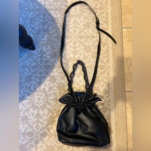 Leather “pouch” style handbag